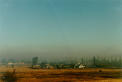 Smog.  This is the view around every city.  The cloud is brown colored from the air.  Get the picture?
